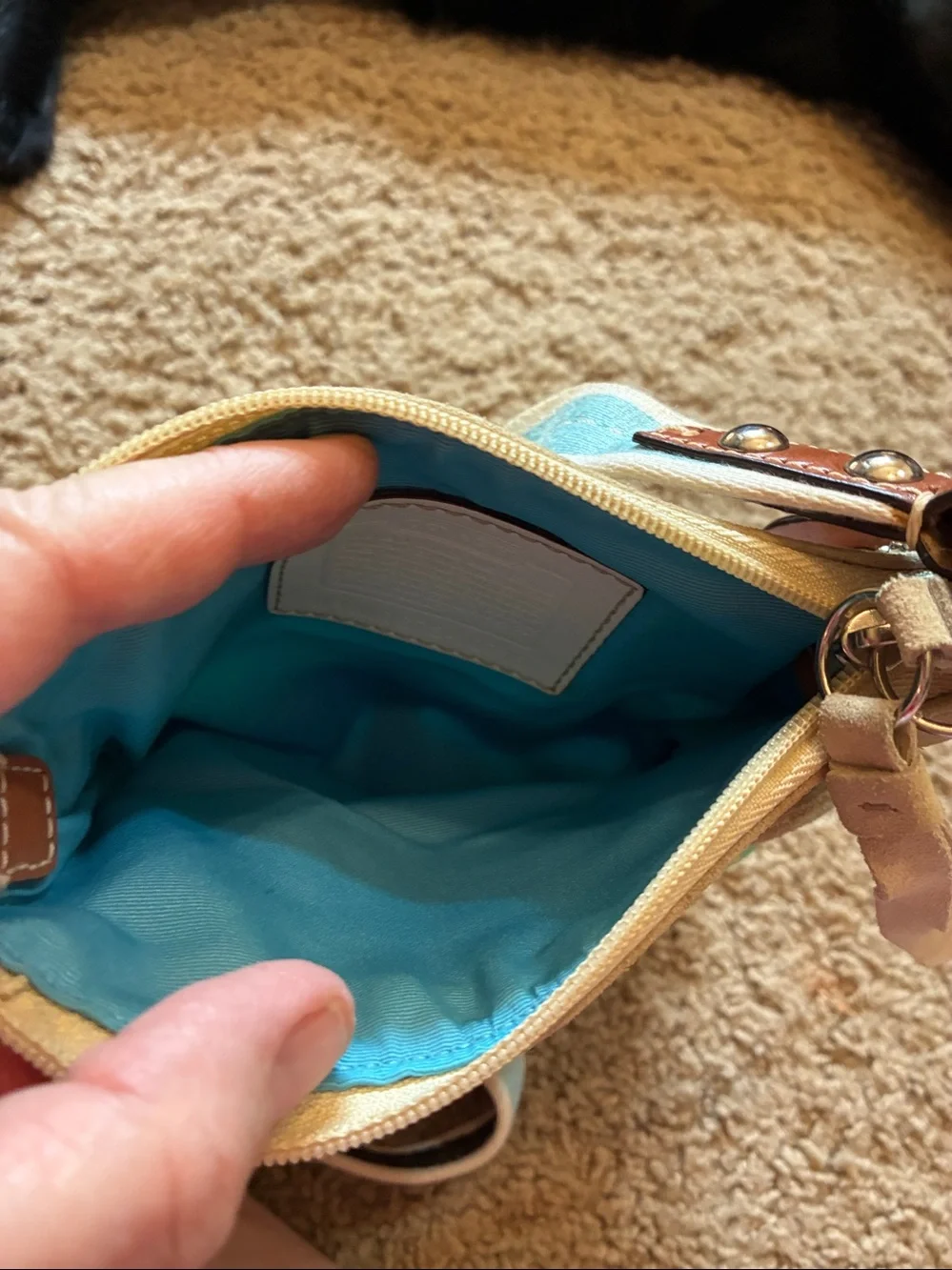 Coach Multicolor Canvas Crossbody bag with Turquoise Lining.